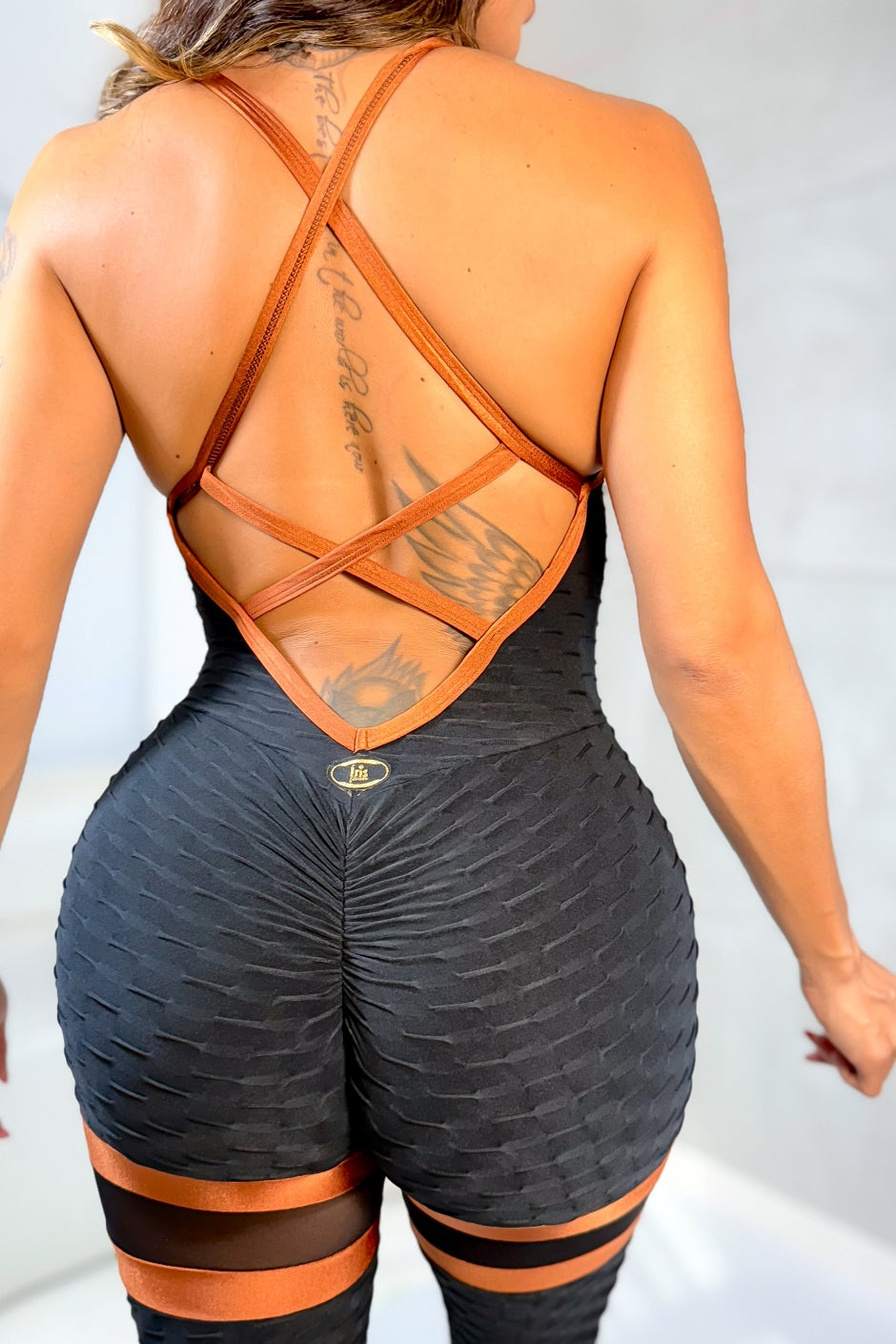 SCRUNCH BOOTY BLACK AND BROWN WAVE AND MASH DETAIL JUMPSUIT,NO RETURN